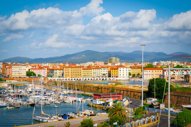 Livorno, Tuscany, Italy Livorno cruise port and harbour with many yachts and boats. Mediterranean destination with colorful buildings along the waterfront of Livorno, Tuscany in Italy livorno stock pictures, royalty-free photos & images