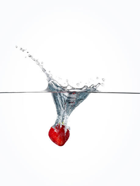 strawberry diving into water