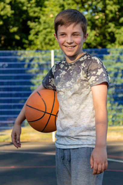 istock Pre-teen caucasian boy playing outside 1010594916
