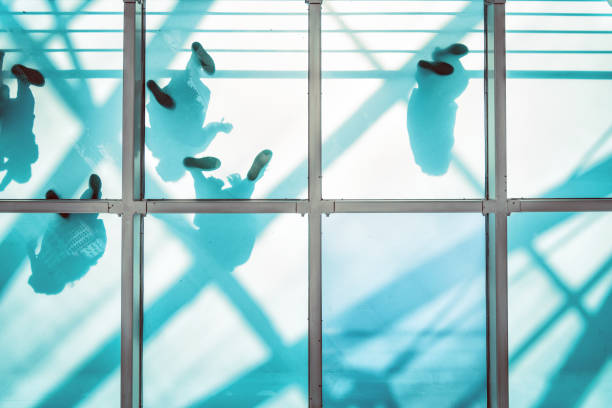 people on pedestrian glass bridge