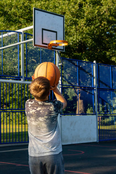 istock Pre-teen caucasian boy playing outside 1010595088