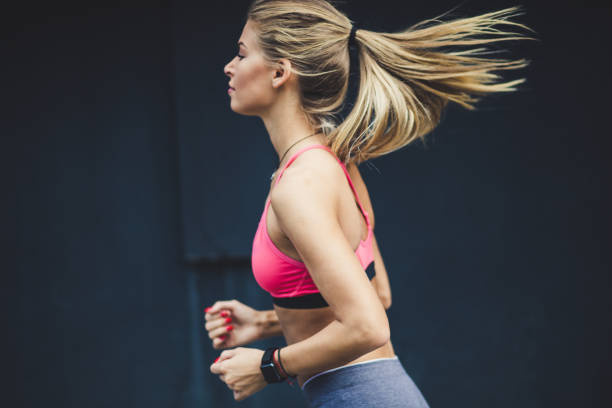istock Side view image of young blonde women running. 1010597542