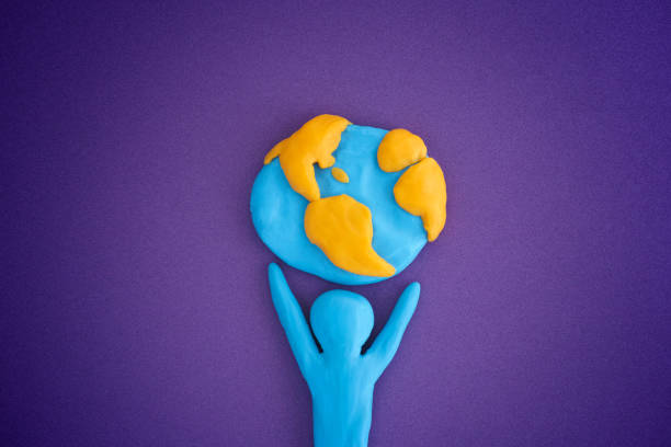 Person holding planet Earth Person holding planet Earth. Person and planet Earth are made out of play clay (plasticine). marble cartoons stock pictures, royalty-free photos & images