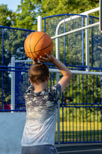 istock Pre-teen caucasian boy playing outside 1010598590