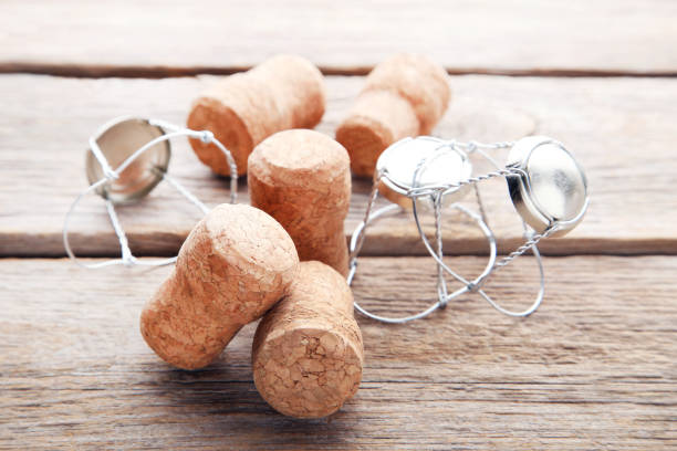 istock Champagne corks with caps on grey wooden table 1010598734