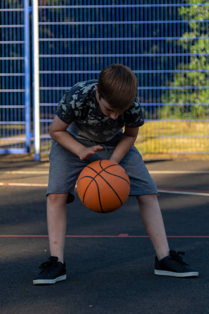 istock Pre-teen caucasian boy playing outside 1010600974