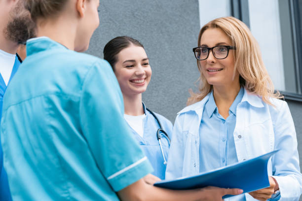 istock smiling medical students standing with lecturer near university 1010601200