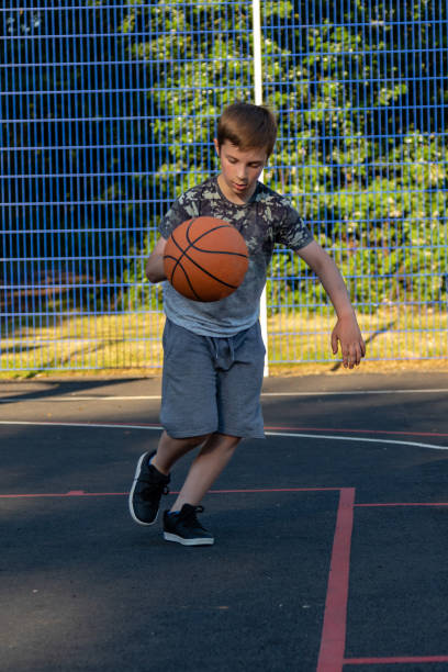 istock Pre-teen caucasian boy playing outside 1010601348