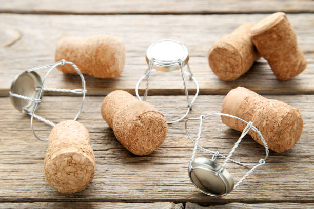 istock Champagne corks with caps on grey wooden table 1010601390