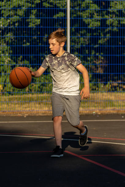istock Pre-teen caucasian boy playing outside 1010601694