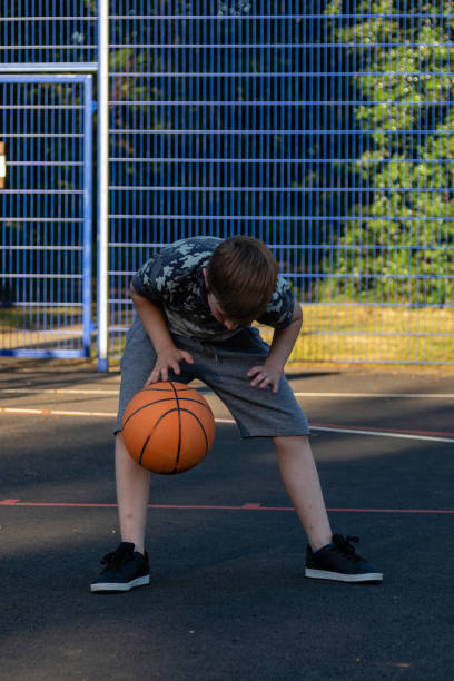 istock Pre-teen caucasian boy playing outside 1010602218