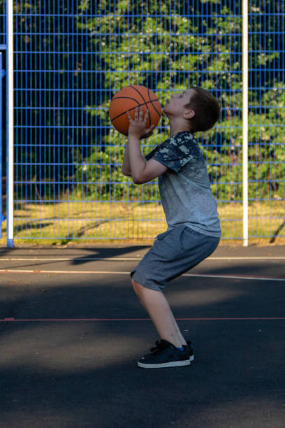 istock Pre-teen caucasian boy playing outside 1010602476