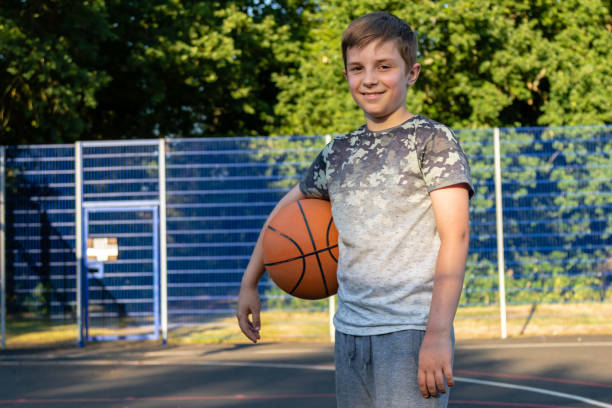 istock Pre-teen caucasian boy playing outside 1010604940