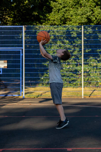istock Pre-teen caucasian boy playing outside 1010605362