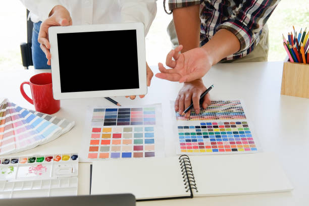 istock Graphic designer present something in digital tablet on artist workplace. 1010605388