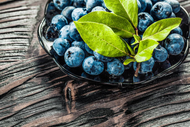 istock Juicy bilberries on vintage plate 1010605978