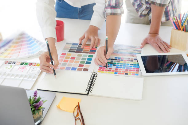 istock Creative graphic designer sketch pencil on notebook paper with pre project on artist workplace. 1010606078