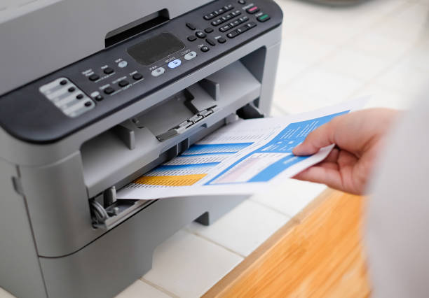 istock Close up a woman is printing document. 1010606478