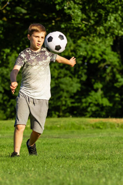 istock Pre-teen caucasian boy playing outside 1010606790
