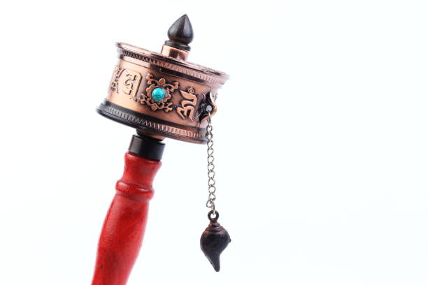 Tibetan Prayer wheel on white background, isolate. form Buddhist Temple of Bhutan. For increase good karma or lucky.Tibetan Prayer wheel on white background, isolate. form Buddhist Temple of