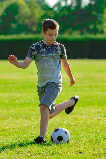 istock Pre-teen caucasian boy playing outside 1010609962