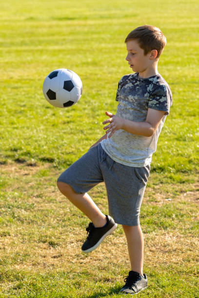 istock Pre-teen caucasian boy playing outside 1010610086