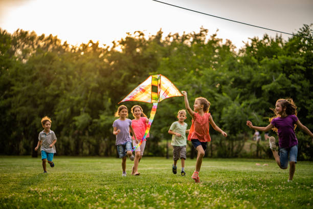 istock Happy children running for flying dragon 1010610358