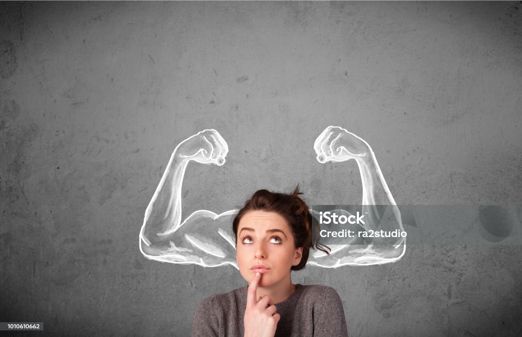 Young woman with strong muscled arms Pretty young woman with sketched strong and muscled arms Strength Stock Photo