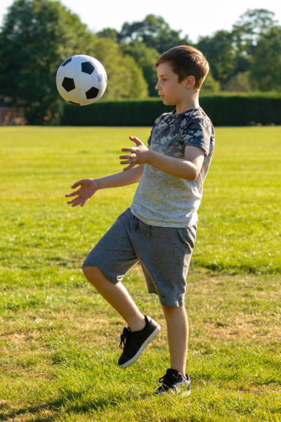 istock Pre-teen caucasian boy playing outside 1010610730
