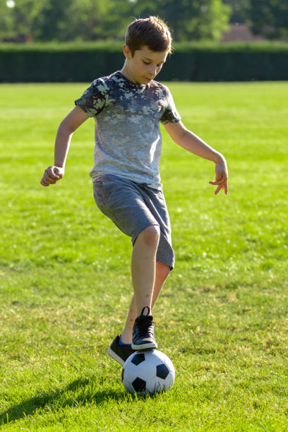 istock Pre-teen caucasian boy playing outside 1010611020