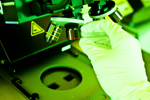 istock Scientist Developing Mask Patterns Of Sensors Unto Semiconductor Wafer In A Photolithography Room 1010613144