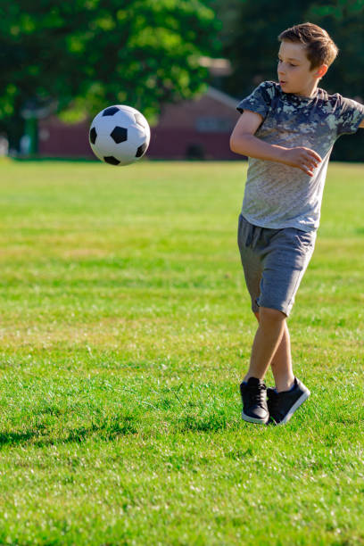 istock Pre-teen caucasian boy playing outside 1010613498