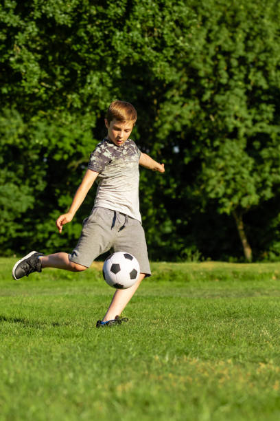 istock Pre-teen caucasian boy playing outside 1010613788