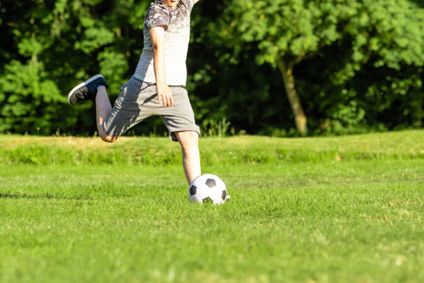 istock Pre-teen caucasian boy playing outside 1010614050