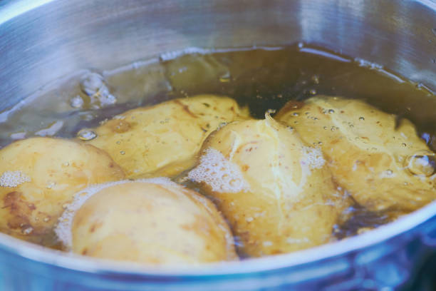 istock potatoes in the skin boiling in a camping pot 1010614606