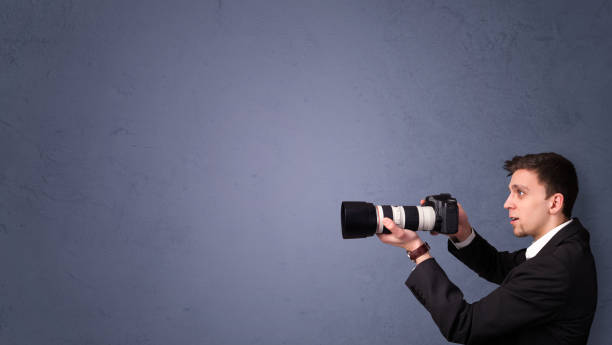 istock Young photographer shooting images with copyspace area 1010614652