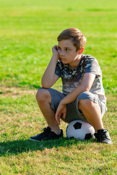 istock Pre-teen caucasian boy playing outside 1010614892