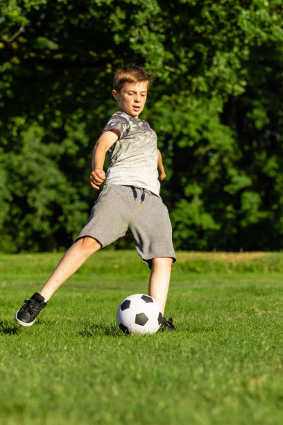 istock Pre-teen caucasian boy playing outside 1010615038