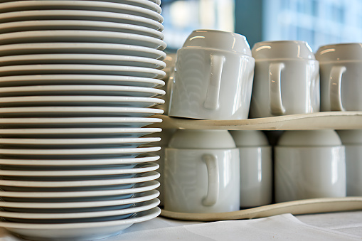 Plates and cups stacked