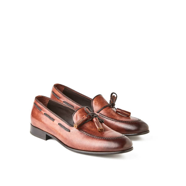 istock Elegant men's brown loafers shoes. Studio, white background 1010617544