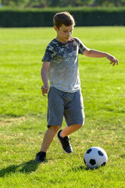 istock Pre-teen caucasian boy playing outside 1010618546