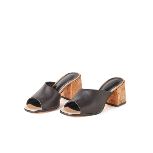istock Black open toe block heel mules shoes. Studio shot, white background 1010618860