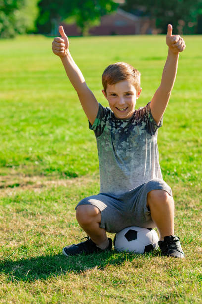 istock Pre-teen caucasian boy playing outside 1010619474