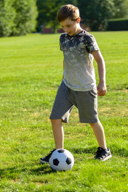 istock Pre-teen caucasian boy playing outside 1010619690