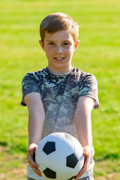 istock Pre-teen caucasian boy playing outside 1010624366