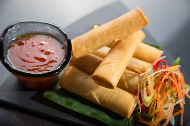 spring rolls with fresh salad and sweet and sour sauce