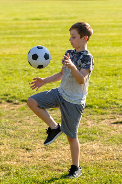 istock Pre-teen caucasian boy playing outside 1010625082