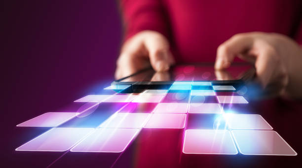 istock Close up of hand holding tablet with cyber application 1010625176