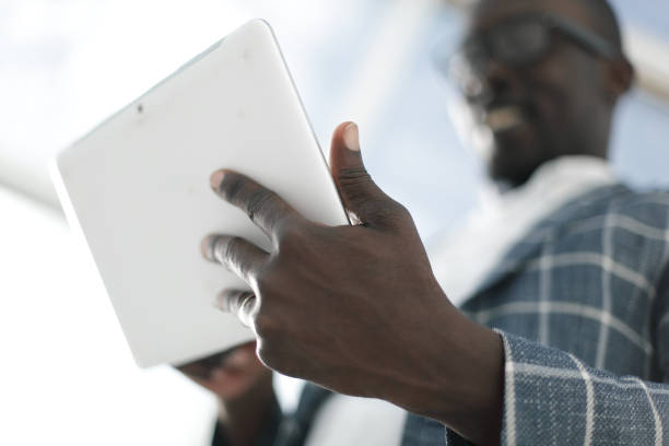 istock close up.successful businessman with digital tablet 1010630096