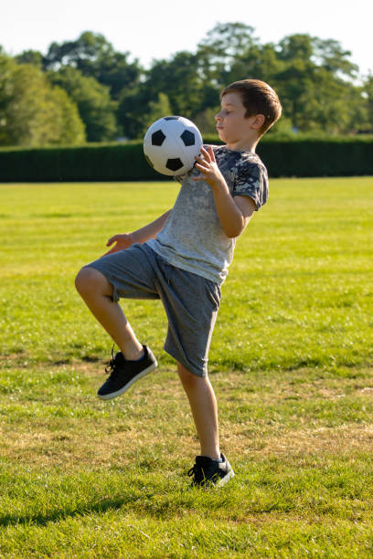 istock Pre-teen caucasian boy playing outside 1010630690